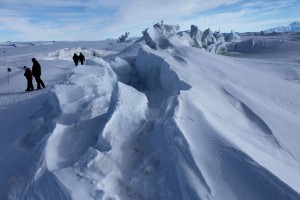 Sea ice floes bump into each other while floating on the ocean surface