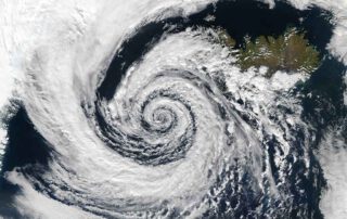 This huge system swirled over the Denmark Strait in between Greenland and Iceland. The image was taken by the Aqua MODIS instrument on September 4, 2003.