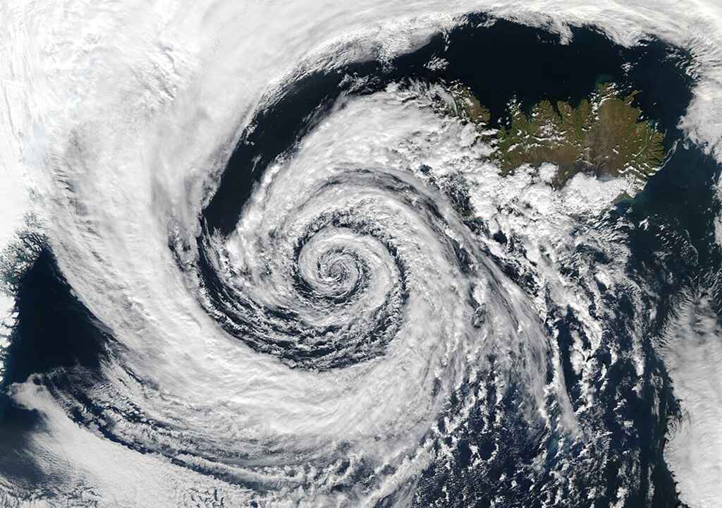 This huge system swirled over the Denmark Strait in between Greenland and Iceland. The image was taken by the Aqua MODIS instrument on September 4, 2003.